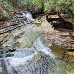 Woman hiking at 47 on the Devil's Bathtub Virginia trail
