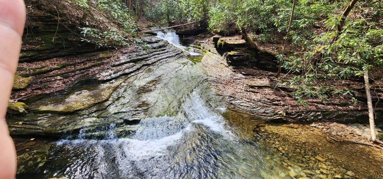 Woman hiking at 47 on the Devil's Bathtub Virginia trail