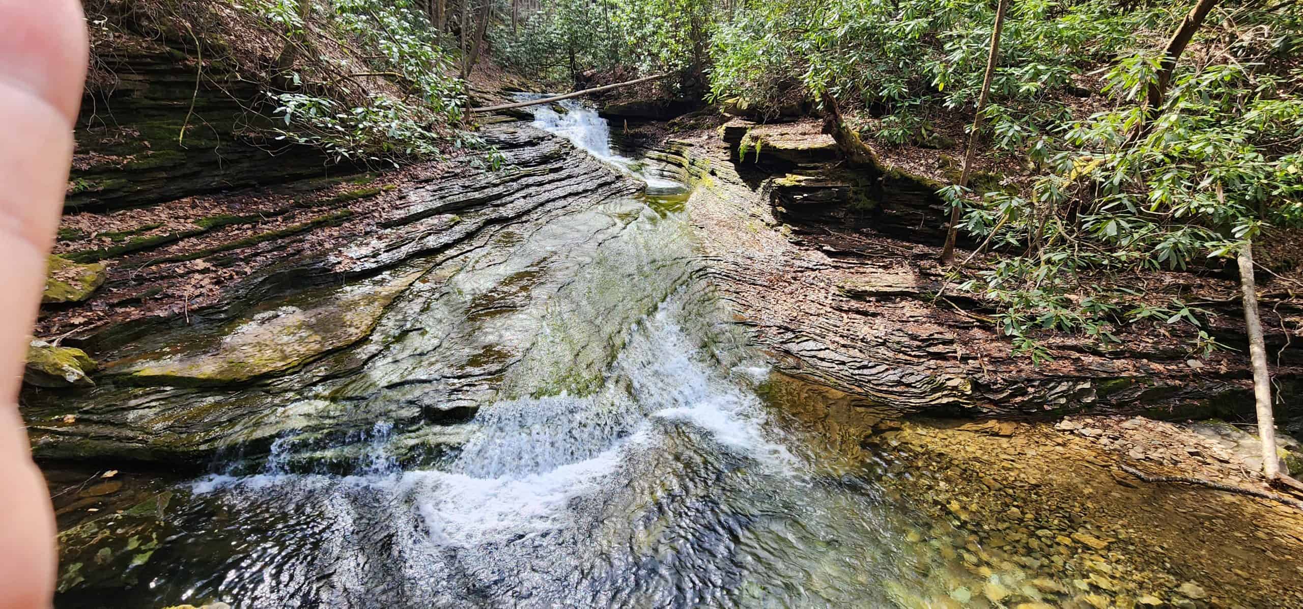 Woman hiking at 47 on the Devil's Bathtub Virginia trail
