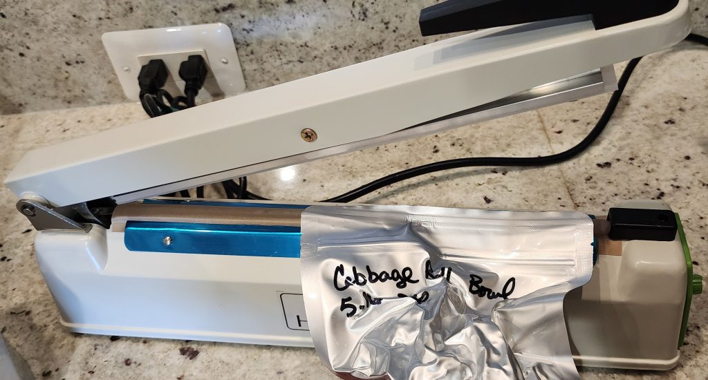 Resealing a questionable seal using and impulse sealer set on #6 heat level for 7 mil thick mylar.